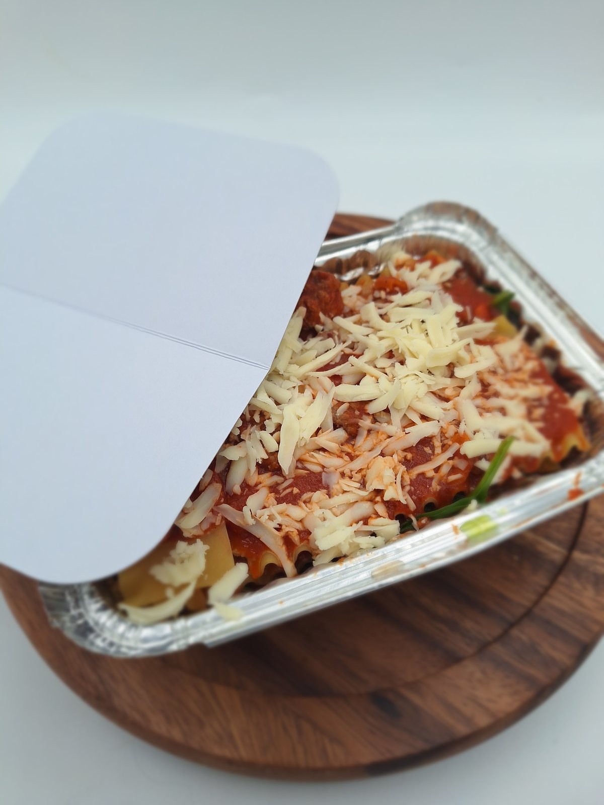 Ready-to-bake family lasagna in a foil tray