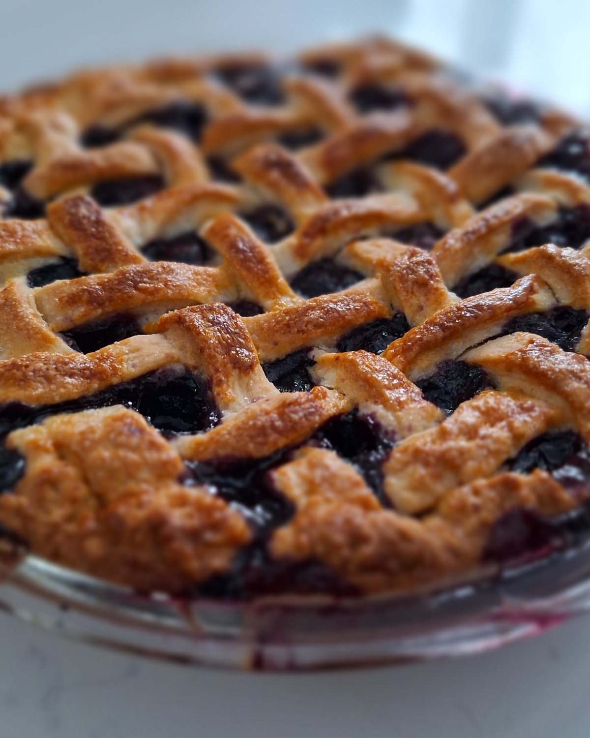A lattice-top blueberry pie, baked at home